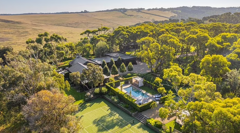 Behind this vine-covered barn lies a dream country estate – complete with a bar, bowling alley and outdoor entertaining space like no other in Australia